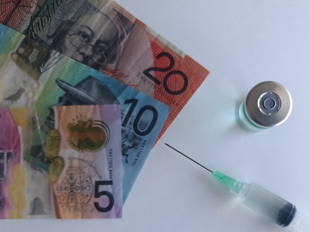 australian banknotes, syringe and bottle with medicineの写真素材