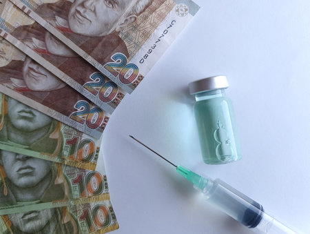 peruvian banknotes, syringe and bottle with medicineの写真素材