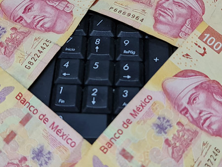 approach to mexican banknotes and computer numeric keypadの写真素材