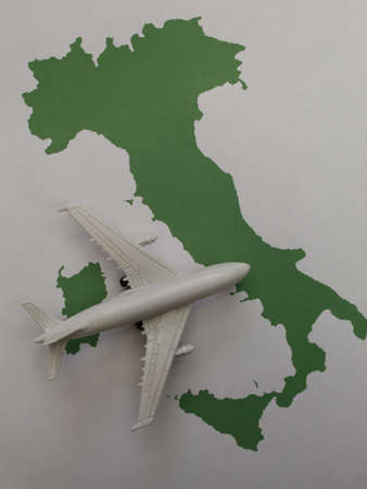 figure of a white plane on a map of Italy