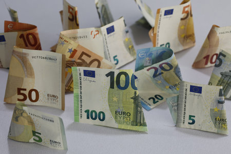 European banknotes of different denominations folded on the tableの写真素材