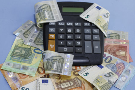 calculator and European banknotes of different denominationsの写真素材