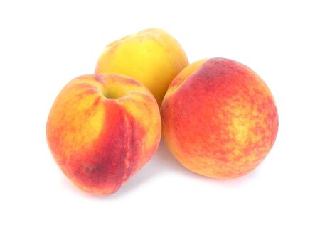 Ripe peaches on a white background are shown in the picture.の写真素材