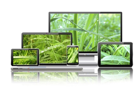 Laptop, tablet pc, mobile phone, TV and navigator with nature wallpaper are shown in the image の写真素材