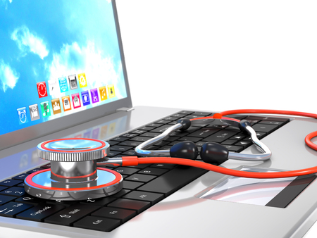 Stethoscope and laptop are on white background.の写真素材