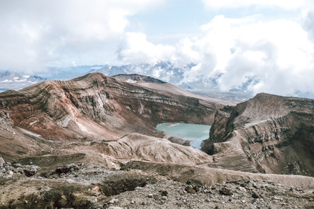 View of mountains and volcanoes from the edge of the craterの写真素材