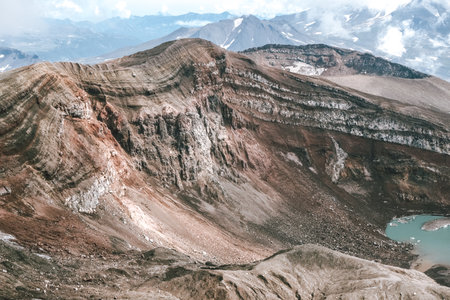 View of mountains and volcanoes from the edge of the craterの写真素材
