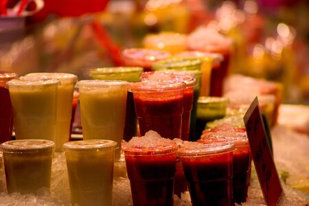Iced fruit juces at the Boqueria market in Barcelonaの写真素材