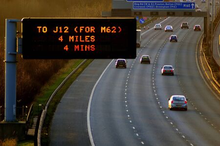 Motorway to Liverpool, with Matrix sign informing drivers of distance and time to a certain junction...