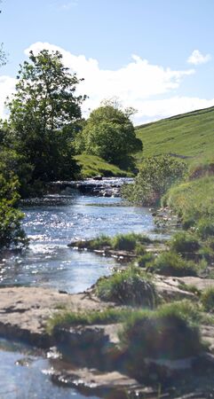 River Wharfe descending down the valley of Wharfedalein North Yorkshireの写真素材