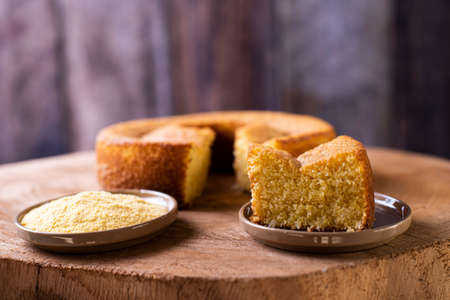 Cornmeal cake on a wooden background. Piece of cake of cornmeal.の写真素材
