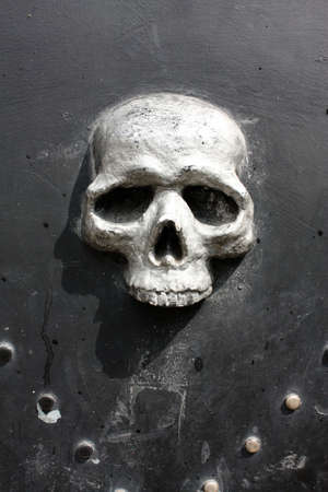 Skull in metal door, Siena, Italyの写真素材