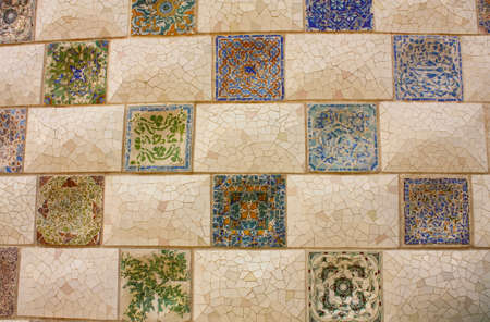 Gaudi Mosaic. Detail of a wall in the park / garden Parc Guell in Barcelona.の写真素材