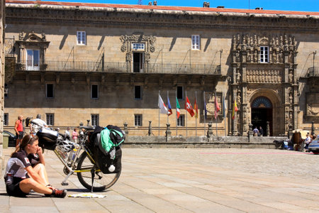 Santiago de Compostela. Spain. May 31th, 2009 Pilgrims on the Camino de Santiago in Obradoiro square, front of the Cathedral, after arriving on bicycle in Santiago de Compostela. 2010 is a Jacobean Holy Year. Spainのeditorial素材