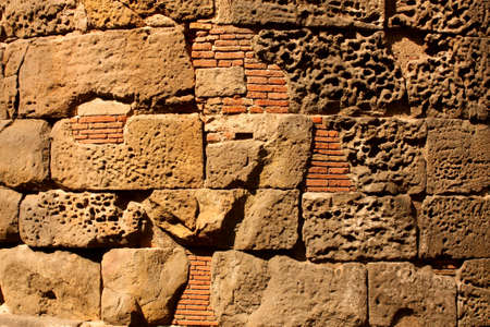 Roman wall in the city of Barcelona. Background pictureの写真素材