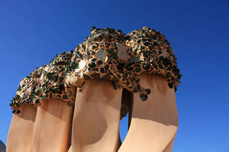 On the terrace of the Casa Mila (also called La Pedrera) is a cross-shaped chimneys and soldiers of anthropomorphic forms created by Antonio Gaudi. の写真素材