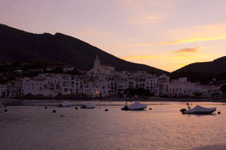 Sunset in Cadaques. Mediterranean. Cadaques, a small coastal town, is the small town of the Catalan painter Salvador Dali. The Church of Cadaques is a symbol in the village. The village is within a natural park. Girona, Costa Brava, Spainの写真素材