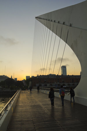 Pedestrians crossing the Bridge of the Woman in the neighborhood of Puerto Madero, over the Rio de la Plata. Buenos Aires, Argentina.のeditorial素材