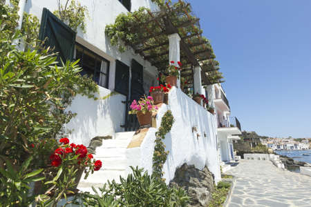 White house, typical of the Mediterranean, adorned with flowers and plants  Costa Brava, Catalonia,...
