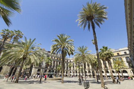Tourists on Plaza Real on June 12, 2013 in Barcelona, Spain. The Royal Plaza is a square in the Gothic Quarter Barcelona. Located next to La Rambla and is a well-known tourist attraction, especially at night.のeditorial素材