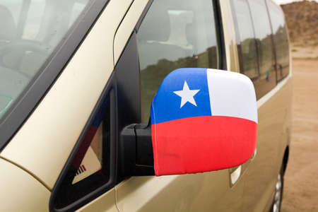 Chilean patriotic symbol in a mirror of a car  National Week, Chile 