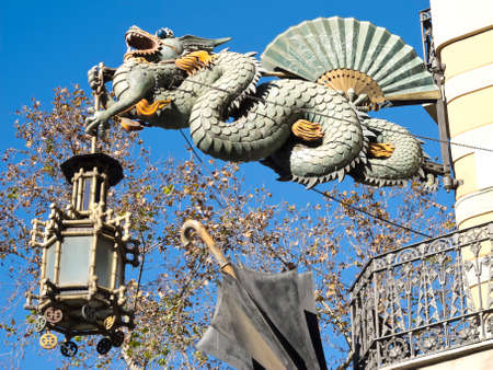 Chinese Dragon and umbrella, modernism architecture  Casa Bruno Cuadros , in the Ramblas  Barcelona, Catalonia, Spain  Orientalist style, is an old store of umbrellas, canes and fans of mid-nineteenth centuryの写真素材