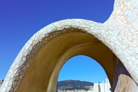 On the terrace of the Casa Mila (also called La Pedrera) is a cross-shaped chimneys and soldiers of anthropomorphic forms created by Antonio Gaudi. It was created in 1905. Photo background.のeditorial素材