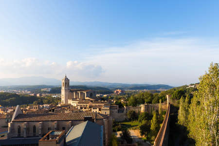 The medieval quarter of Gerona with bell tower of Santa Maria cathedral in background. View from The Forca Vella. Gerona, Costa Brava, Catalonia, Spain.の写真素材