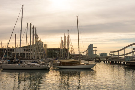 BARCELONA - MAR 1: Sunrise at the port of Barcelona, at the end of the Ramblas on March 1, 2017 in Catalonia, Spain. In the photo, the Ramblas on the sea, the World trade center building and the funicular tower.のeditorial素材