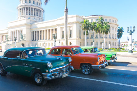 HAVANA, CUBA - JANUARY 16, 2017: A vintage car circulating in front of the Capitol in Havana, Cuba. Cubans, unable to buy newer models, keep thousands of them running.のeditorial素材