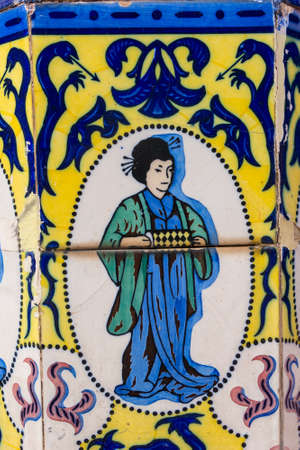 Set of typical Catalan mosaics, with animal and nature motifs, and oriental figure. Barcelona, Spain.の写真素材