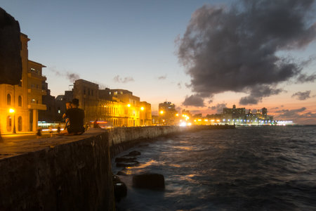 HAVANA, CUBA- JANUARY 15 2017: Sunset at Malecon, the famous Havana promenades where Habaneros, lovers and most of all individual fishermen meet, Havana, Cubaのeditorial素材