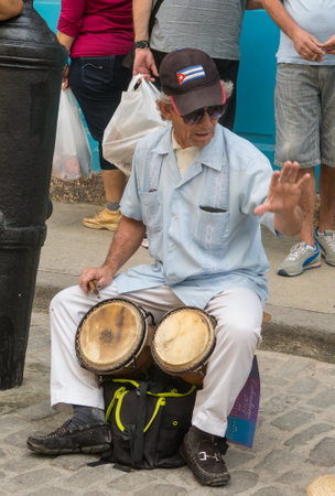 HAVANA, CUBA - JANUARY 16, 2017: Street musician perform for tourists and tips in Old Havana, Havana, Cubaのeditorial素材