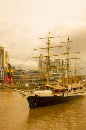 BUENOS AIRES, ARGENTINA - OCTOBER 1: Frigate docked at the dock in Puerto Madero. Ship by night in...