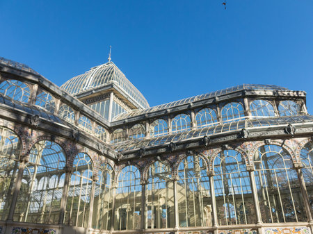 Crystal Palace (Palacio de cristal) in Retiro Park in Madrid, Spain. Retiro Park is one of the largest parks of the city of Madrid, Spain. Architecture and landmark of Madridのeditorial素材