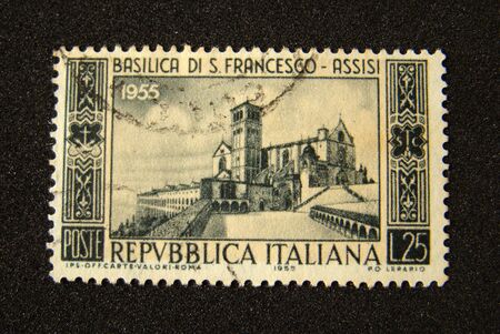 Italy postage stamp on black background.                              の写真素材