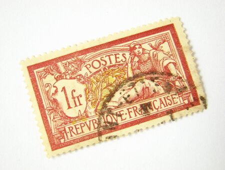 Old postage stamp from France on white backgroundの写真素材