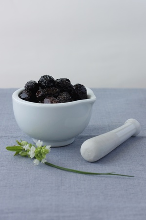 Still life with greek olives on mortarの写真素材