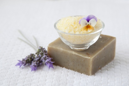 Bath salts and organic soap over white towel backgroundの写真素材