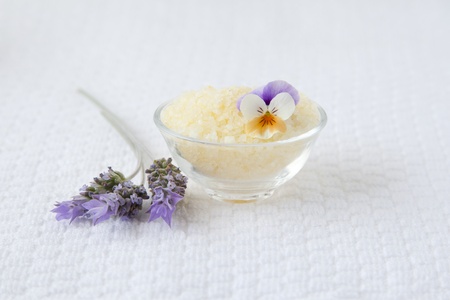 Bath salts and lavender over white towel backgroundの写真素材