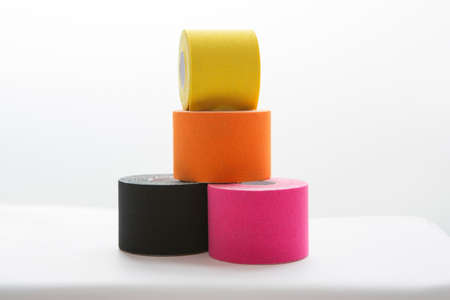 four physiotheraphy belts, black, pink, orange and yellowの写真素材