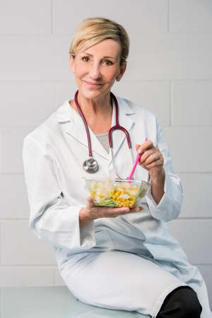 woman doctor having lunch breakの写真素材