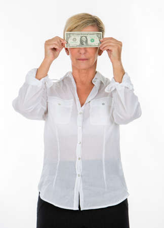manager woman holding banknote covering her eyesの写真素材