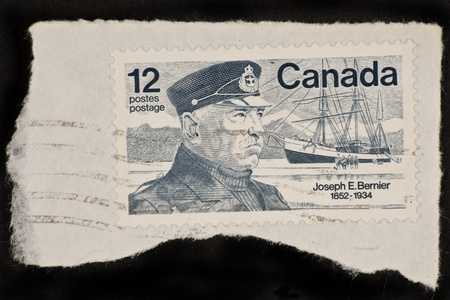 CANADA - CIRCA 1977: A stamp printed in Canada shows a picture of Joseph E. Bernier, the man who solidify Canadaの写真素材