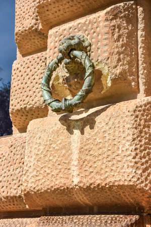 Bronze Lions Head on stone wall at the Palace of Alhambraのeditorial素材