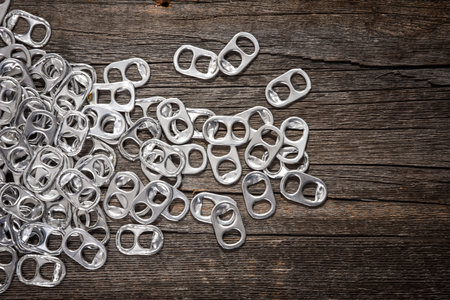 Close up rings pull aluminum of soda or beer can isolate on wooden boardの写真素材