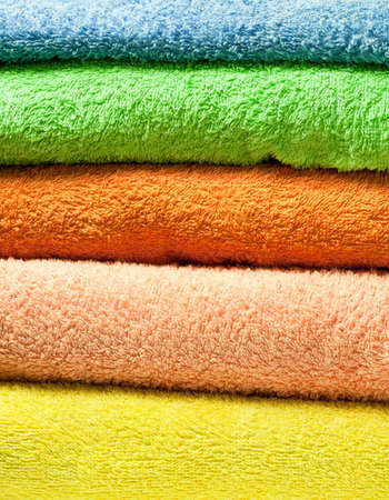 Stack of five colorful towelsの写真素材