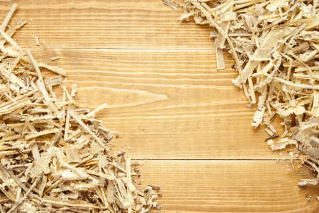 Wooden sawdust and shavings background with space for textの写真素材