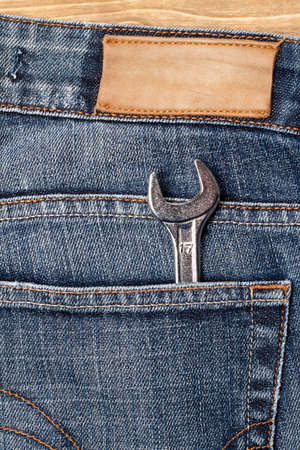 Wrench in blue jeans pocketの写真素材