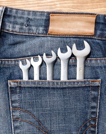Wrenches in blue jeans pocket